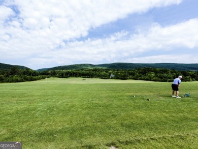 This beautiful wooded lot in the prestigious Lake Arrowhead on The Highlands Course at Lake Arrowhead in Georgia - for sale on GolfHomes.com, golf home, golf lot