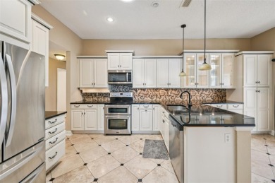 Enjoy refined living in this elegant 3-bedroom, 2.5-bath home on Falcon Watch Golf Club in Florida - for sale on GolfHomes.com, golf home, golf lot