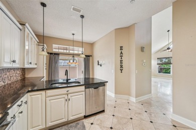 Enjoy refined living in this elegant 3-bedroom, 2.5-bath home on Falcon Watch Golf Club in Florida - for sale on GolfHomes.com, golf home, golf lot