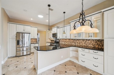Enjoy refined living in this elegant 3-bedroom, 2.5-bath home on Falcon Watch Golf Club in Florida - for sale on GolfHomes.com, golf home, golf lot