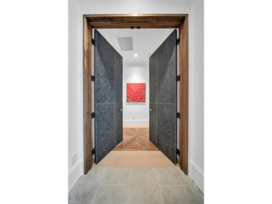 This residence has been completely reimagined in 2024 with a on Grey Oaks Golf and Country Club in Florida - for sale on GolfHomes.com, golf home, golf lot