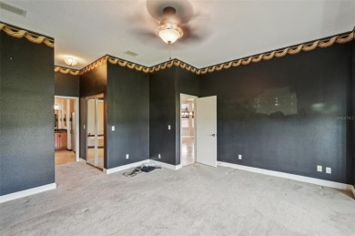 Enjoy refined living in this elegant 3-bedroom, 2.5-bath home on Falcon Watch Golf Club in Florida - for sale on GolfHomes.com, golf home, golf lot