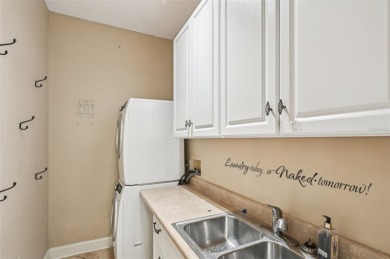 Enjoy refined living in this elegant 3-bedroom, 2.5-bath home on Falcon Watch Golf Club in Florida - for sale on GolfHomes.com, golf home, golf lot