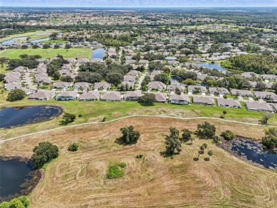 Enjoy refined living in this elegant 3-bedroom, 2.5-bath home on Falcon Watch Golf Club in Florida - for sale on GolfHomes.com, golf home, golf lot