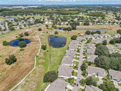 Enjoy refined living in this elegant 3-bedroom, 2.5-bath home on Falcon Watch Golf Club in Florida - for sale on GolfHomes.com, golf home, golf lot