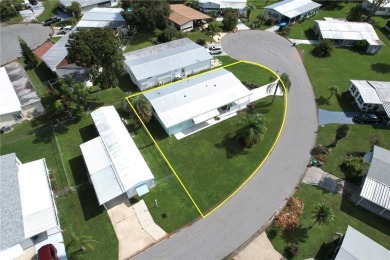 Coastal style home features metal roof & newer A/C and Golf on Barefoot Bay Golf Course in Florida - for sale on GolfHomes.com, golf home, golf lot