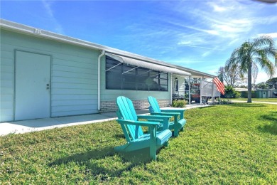 Coastal style home features metal roof & newer A/C and Golf on Barefoot Bay Golf Course in Florida - for sale on GolfHomes.com, golf home, golf lot