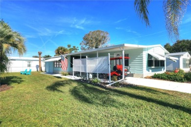 Coastal style home features metal roof & newer A/C and Golf on Barefoot Bay Golf Course in Florida - for sale on GolfHomes.com, golf home, golf lot