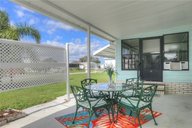 Coastal style home features metal roof & newer A/C and Golf on Barefoot Bay Golf Course in Florida - for sale on GolfHomes.com, golf home, golf lot