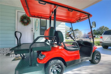 Coastal style home features metal roof & newer A/C and Golf on Barefoot Bay Golf Course in Florida - for sale on GolfHomes.com, golf home, golf lot