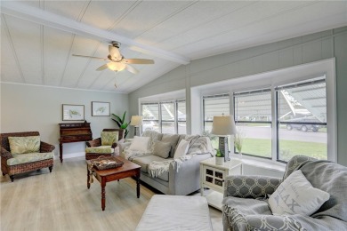 Coastal style home features metal roof & newer A/C and Golf on Barefoot Bay Golf Course in Florida - for sale on GolfHomes.com, golf home, golf lot