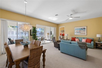 This spacious, well-designed second-floor end-unit is located in on Windstar on Naples Bay in Florida - for sale on GolfHomes.com, golf home, golf lot
