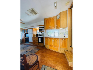 FLORIDA WATERFRONT PROPERTY. AFFORDABLE EASY LIVING. WELCOME TO on Cypress Point RV Golf Club in Florida - for sale on GolfHomes.com, golf home, golf lot