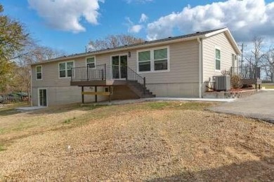 This beautifully remodeled 3-bedroom, 2-bathroom home is on Kings River Golf Course in Missouri - for sale on GolfHomes.com, golf home, golf lot