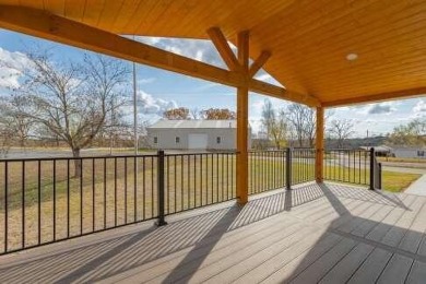 This beautifully remodeled 3-bedroom, 2-bathroom home is on Kings River Golf Course in Missouri - for sale on GolfHomes.com, golf home, golf lot