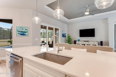 Modern elegance meets serene golf course views in this like-new on Venetian Bay Golf Course in Florida - for sale on GolfHomes.com, golf home, golf lot