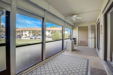 COVETED GROUND FLOOR CORNER UNIT WITH PARKING SPACE RIGHT IN on The Golf Club of Jupiter in Florida - for sale on GolfHomes.com, golf home, golf lot