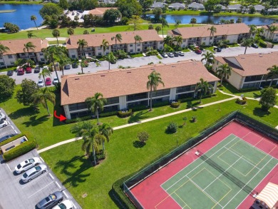 COVETED GROUND FLOOR CORNER UNIT WITH PARKING SPACE RIGHT IN on The Golf Club of Jupiter in Florida - for sale on GolfHomes.com, golf home, golf lot