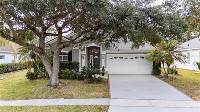 Beautiful 3-bedroom, 2.5-bath home with a large screened-in pool on Hunters Creek Golf Course in Florida - for sale on GolfHomes.com, golf home, golf lot