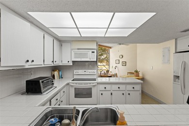 LOWEST PRICED THREE BEDROOM UNIT!! TOP SCHOOL DISTRICT! Spacious on  in Florida - for sale on GolfHomes.com, golf home, golf lot