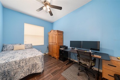 Beautiful 3-bedroom, 2.5-bath home with a large screened-in pool on Hunters Creek Golf Course in Florida - for sale on GolfHomes.com, golf home, golf lot