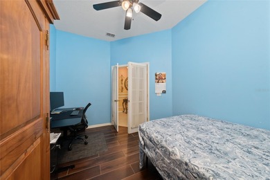 Beautiful 3-bedroom, 2.5-bath home with a large screened-in pool on Hunters Creek Golf Course in Florida - for sale on GolfHomes.com, golf home, golf lot