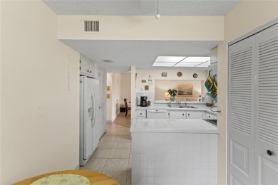 LOWEST PRICED THREE BEDROOM UNIT!! TOP SCHOOL DISTRICT! Spacious on  in Florida - for sale on GolfHomes.com, golf home, golf lot