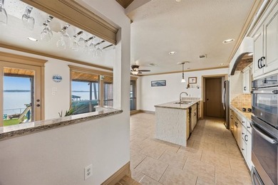 Welcome to your dream waterfront retreat in Cedar Creek Country on Cedar Creek Country Club in Texas - for sale on GolfHomes.com, golf home, golf lot