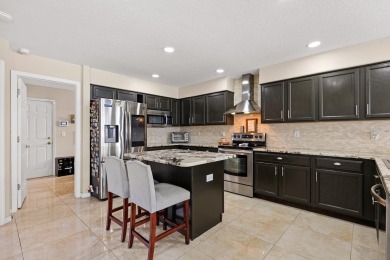 Welcome to this stunning executive home nestled in a gated on The Eagles Golf Course and Club in Florida - for sale on GolfHomes.com, golf home, golf lot