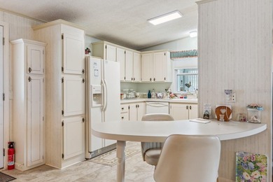 Welcome home to this well-loved, fully furnished 2-bedroom on Lake Henry Golf Club in Florida - for sale on GolfHomes.com, golf home, golf lot