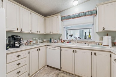 Welcome home to this well-loved, fully furnished 2-bedroom on Lake Henry Golf Club in Florida - for sale on GolfHomes.com, golf home, golf lot