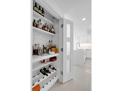 Enjoy ocean & city views from the expansive terrace of this on Coral Ridge Country Club in Florida - for sale on GolfHomes.com, golf home, golf lot