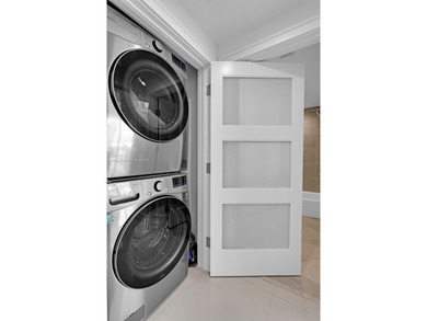 Enjoy ocean & city views from the expansive terrace of this on Coral Ridge Country Club in Florida - for sale on GolfHomes.com, golf home, golf lot