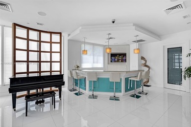 Enjoy ocean & city views from the expansive terrace of this on Coral Ridge Country Club in Florida - for sale on GolfHomes.com, golf home, golf lot