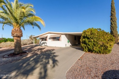 This charming 3-bedroom, 1.75-bath home is nestled on a quiet on Fountain of the Sun Country Club in Arizona - for sale on GolfHomes.com, golf home, golf lot