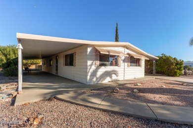 This charming 3-bedroom, 1.75-bath home is nestled on a quiet on Fountain of the Sun Country Club in Arizona - for sale on GolfHomes.com, golf home, golf lot