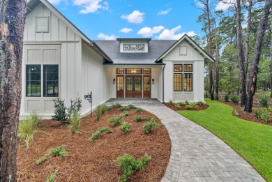 This stunning NEW CONSTRUCTION home Wild Heron is a single level on Sharks Tooth Golf Club in Florida - for sale on GolfHomes.com, golf home, golf lot