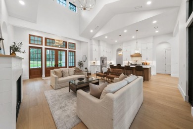 This stunning NEW CONSTRUCTION home Wild Heron is a single level on Sharks Tooth Golf Club in Florida - for sale on GolfHomes.com, golf home, golf lot