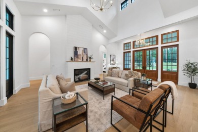 This stunning NEW CONSTRUCTION home Wild Heron is a single level on Sharks Tooth Golf Club in Florida - for sale on GolfHomes.com, golf home, golf lot