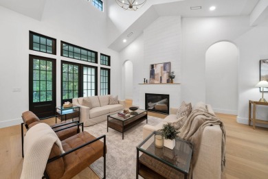 This stunning NEW CONSTRUCTION home Wild Heron is a single level on Sharks Tooth Golf Club in Florida - for sale on GolfHomes.com, golf home, golf lot