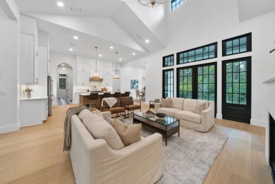 This stunning NEW CONSTRUCTION home Wild Heron is a single level on Sharks Tooth Golf Club in Florida - for sale on GolfHomes.com, golf home, golf lot