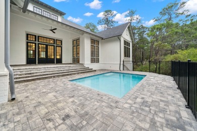 This stunning NEW CONSTRUCTION home Wild Heron is a single level on Sharks Tooth Golf Club in Florida - for sale on GolfHomes.com, golf home, golf lot