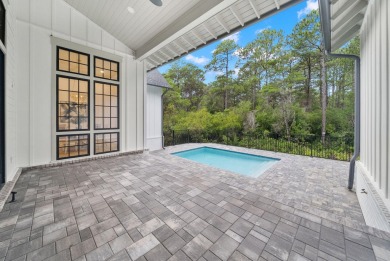 This stunning NEW CONSTRUCTION home Wild Heron is a single level on Sharks Tooth Golf Club in Florida - for sale on GolfHomes.com, golf home, golf lot