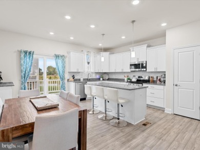 Welcome to 35413 Wright Way, a beautiful three-story end-unit on Plantation Lakes Golf and Country Club in Delaware - for sale on GolfHomes.com, golf home, golf lot