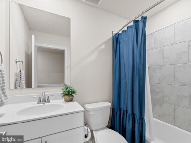 Welcome to 35413 Wright Way, a beautiful three-story end-unit on Plantation Lakes Golf and Country Club in Delaware - for sale on GolfHomes.com, golf home, golf lot