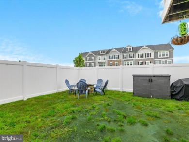 Welcome to 35413 Wright Way, a beautiful three-story end-unit on Plantation Lakes Golf and Country Club in Delaware - for sale on GolfHomes.com, golf home, golf lot
