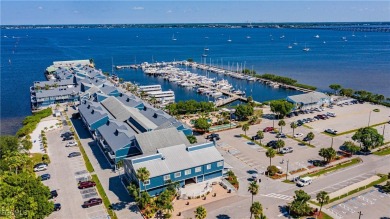 Waterfront Retreat with Boat Slip! Welcome to the ease of on Saint Andrews South Golf Club in Florida - for sale on GolfHomes.com, golf home, golf lot