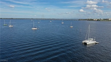 Waterfront Retreat with Boat Slip! Welcome to the ease of on Saint Andrews South Golf Club in Florida - for sale on GolfHomes.com, golf home, golf lot