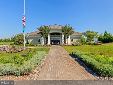 Welcome to 35413 Wright Way, a beautiful three-story end-unit on Plantation Lakes Golf and Country Club in Delaware - for sale on GolfHomes.com, golf home, golf lot