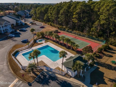 Welcome to your dream retreat! Nestled in the highly on Sandpiper Bay Golf and Country Club in North Carolina - for sale on GolfHomes.com, golf home, golf lot